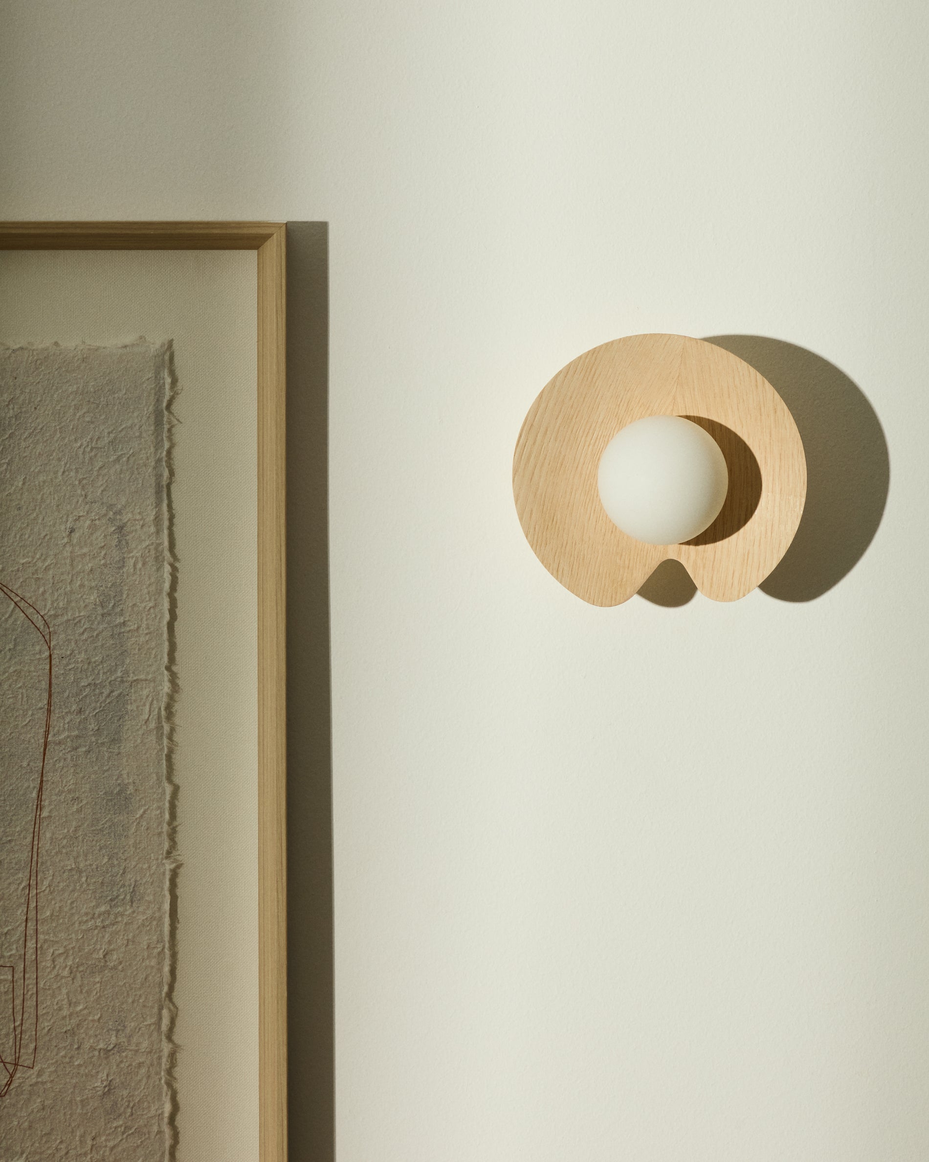 Wilara oak veneer wall-mounted light fixture with 1 smoked glass ball - Lifestyle
