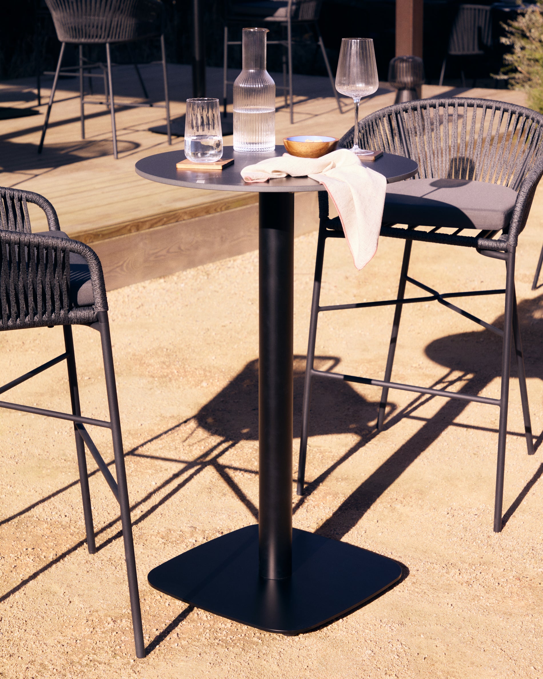 Dina high round outdoor table in black with metal leg in a painted black finish, Ø 60x96 cm - Lifestyle