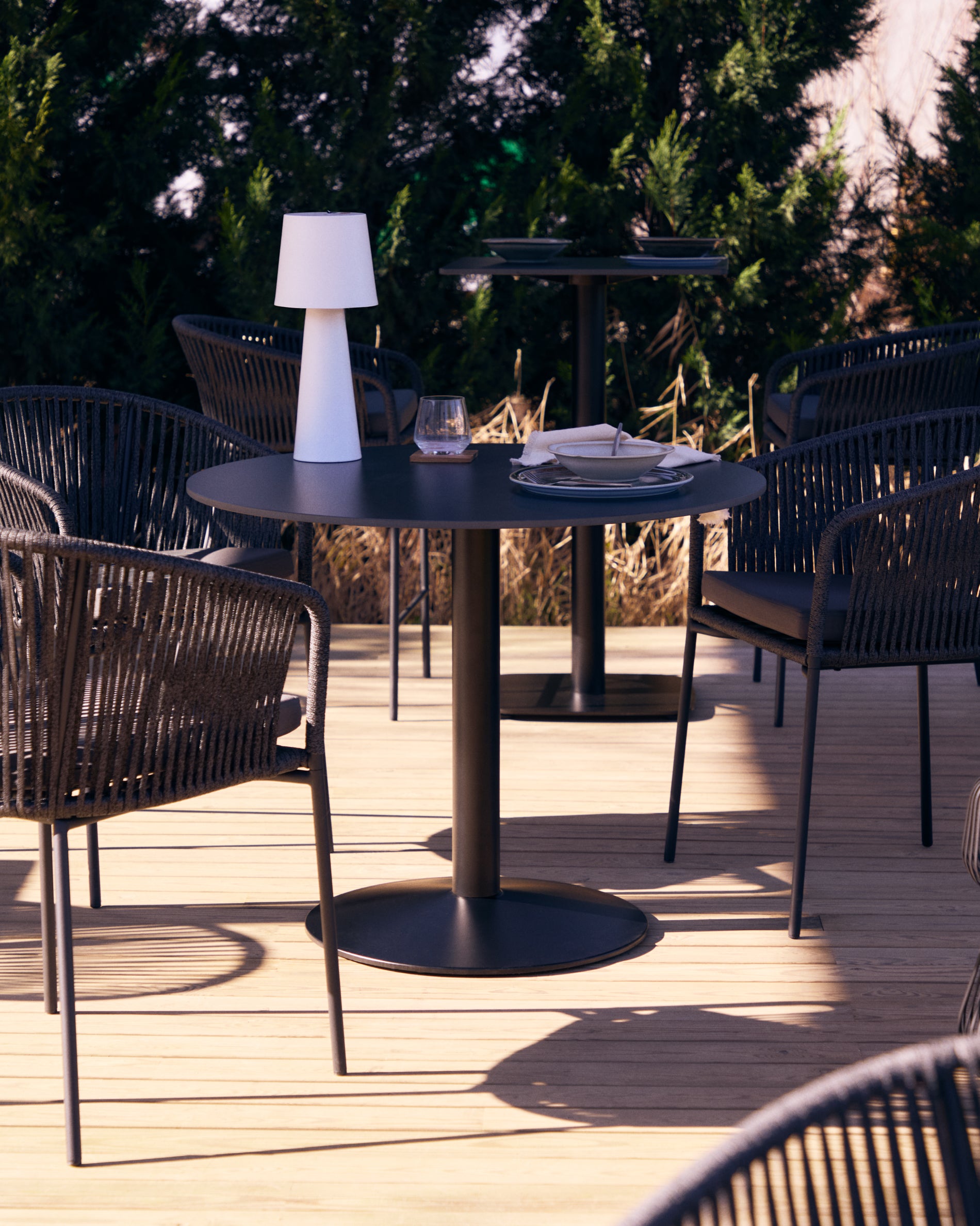 Esilda round outdoor table in black with metal leg in a painted black finish, Ø 90 x 70 cm - Lifestyle