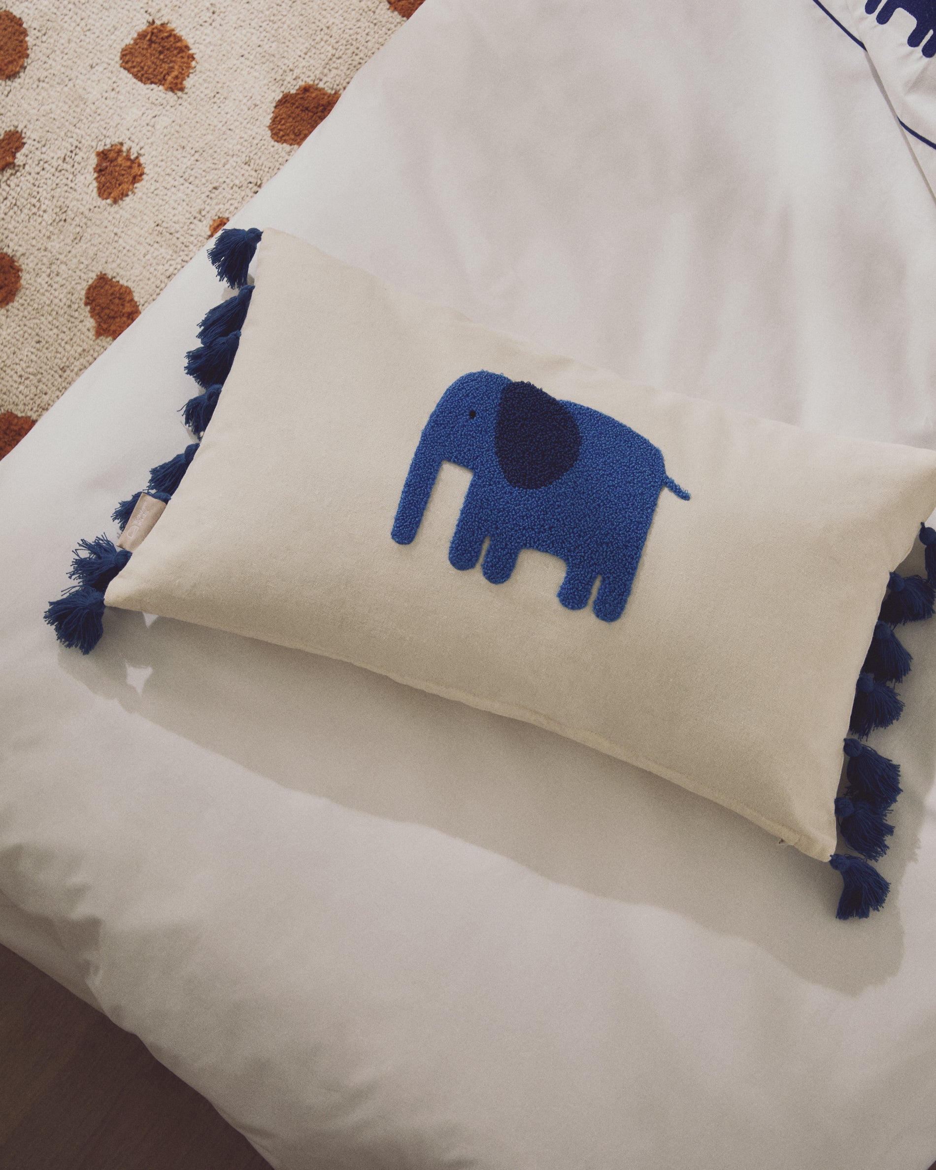 Tandani beige cotton cushion cover with embroidered blue elephant 30 x 50cm - Lifestyle