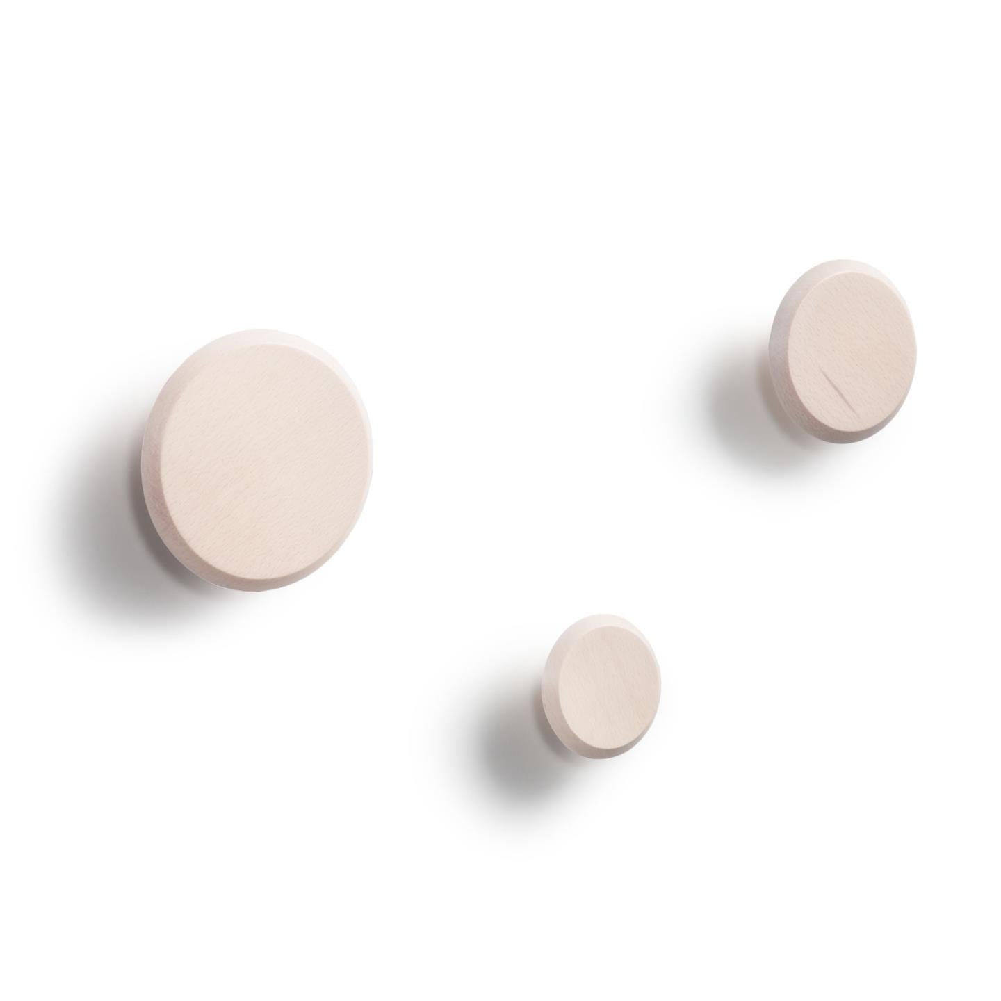 Set of 3 Nadua hangers in solid wood with a natural beech finish. - Product Image