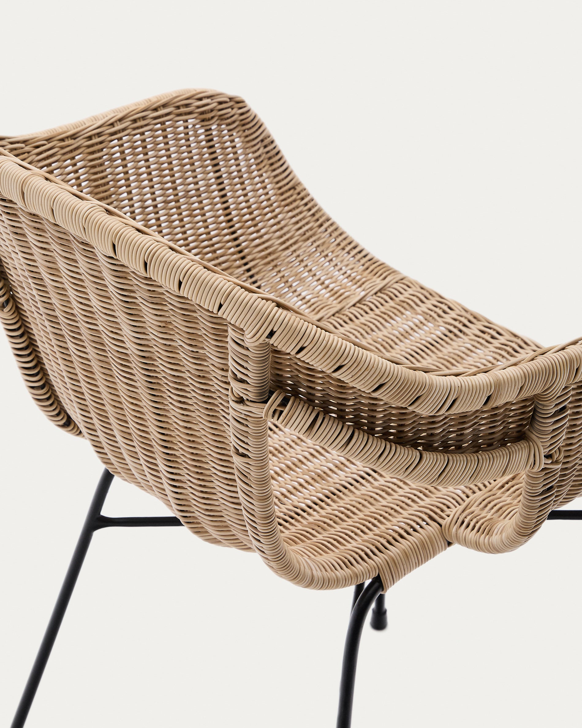 Eltiera stackable chair made of synthetic rattan with black steel structure