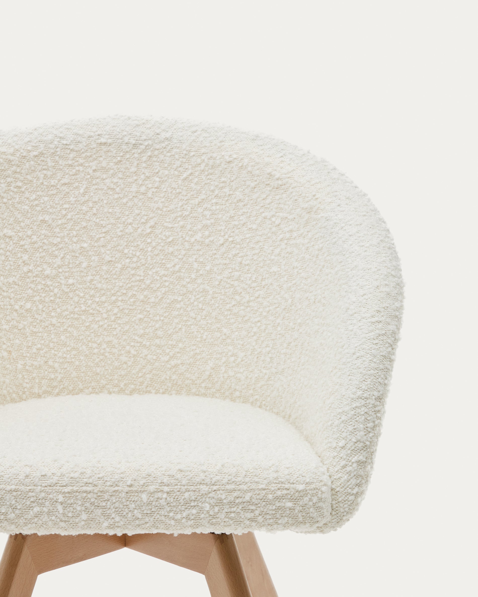 Marvin swivel chair in white bouclé with solid beech wood legs in a natural finish