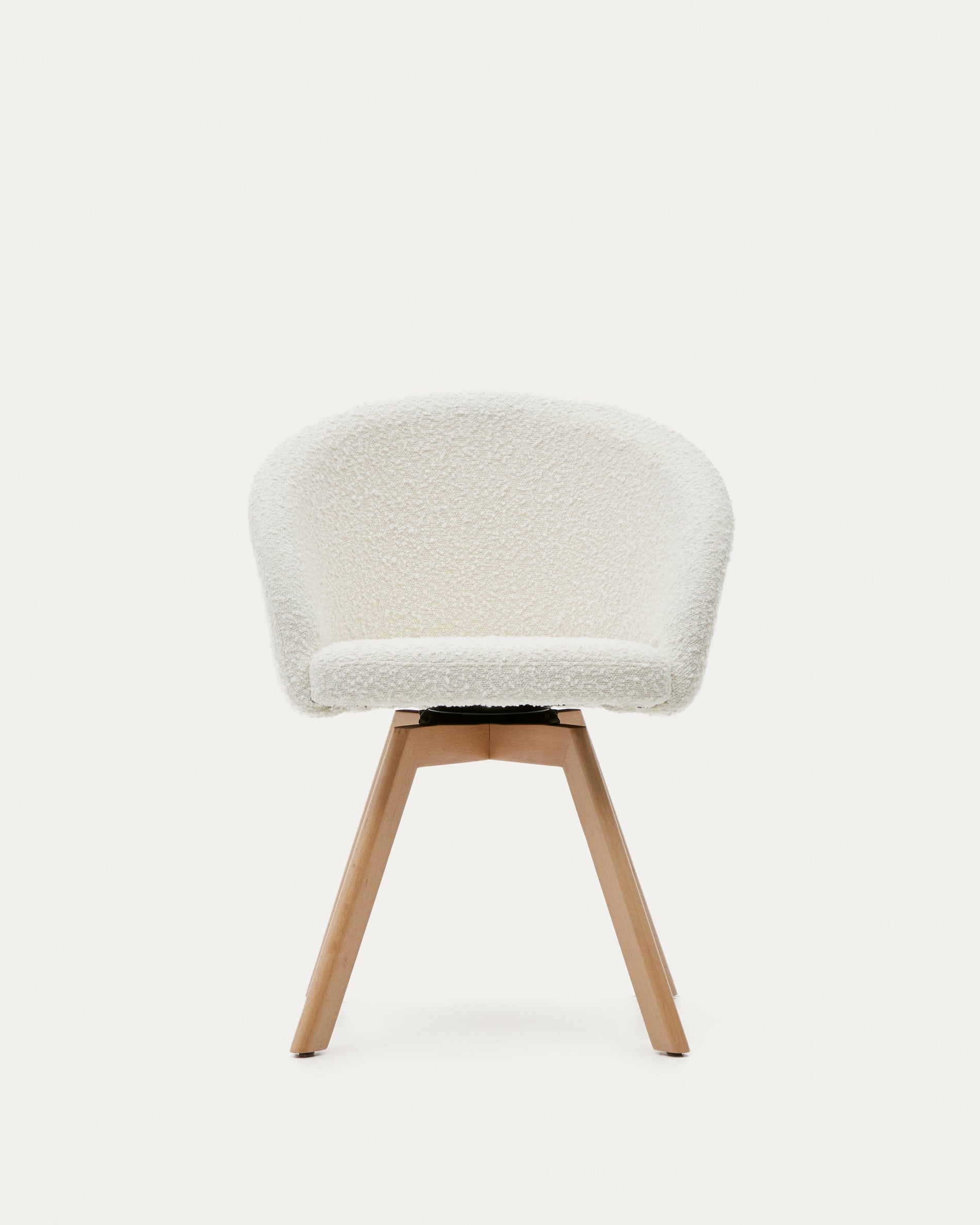 Marvin swivel chair in white bouclé with solid beech wood legs in a natural finish