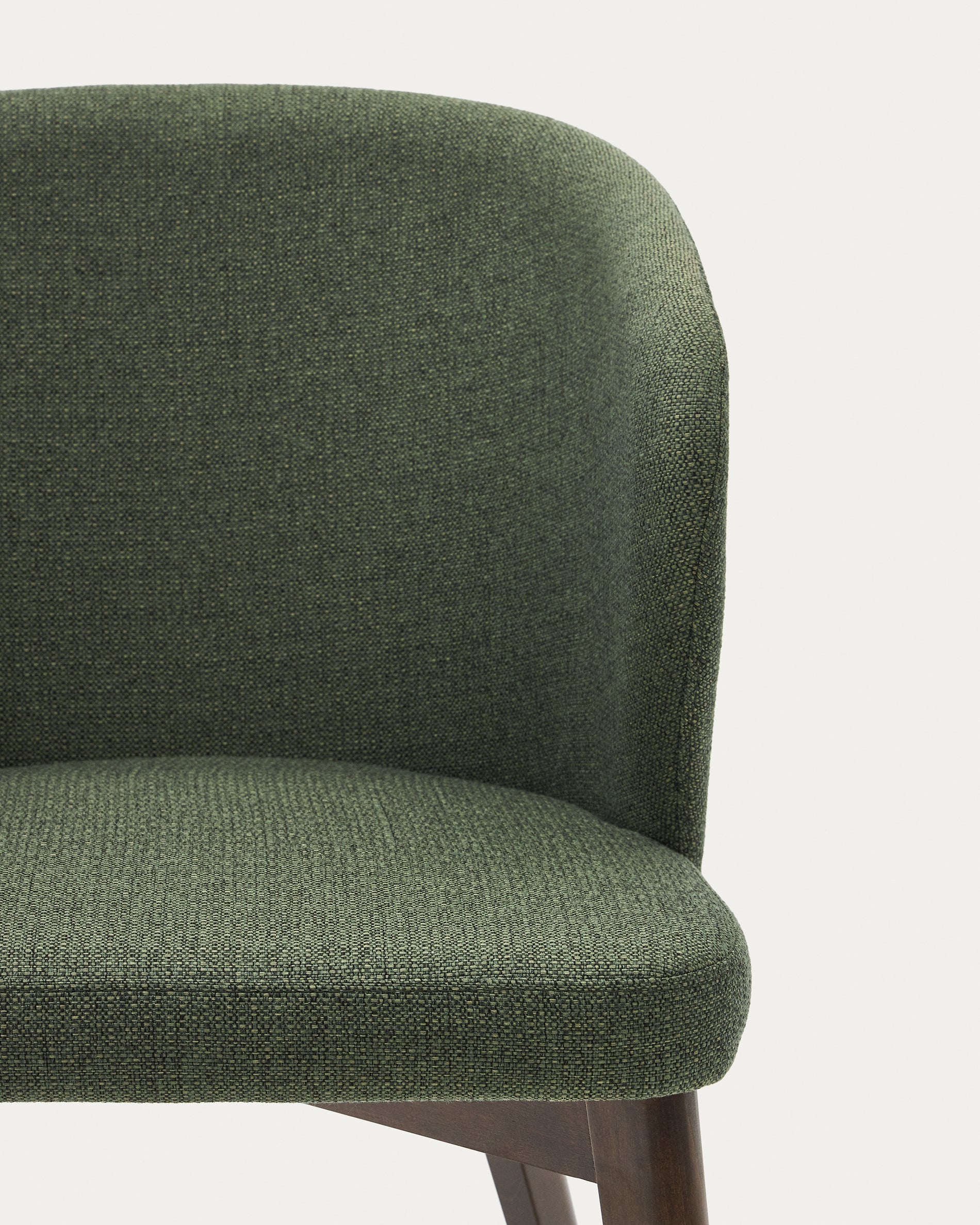 Darice chair with green upholstery and 100% FSC certified solid beech wood with a walnut finish