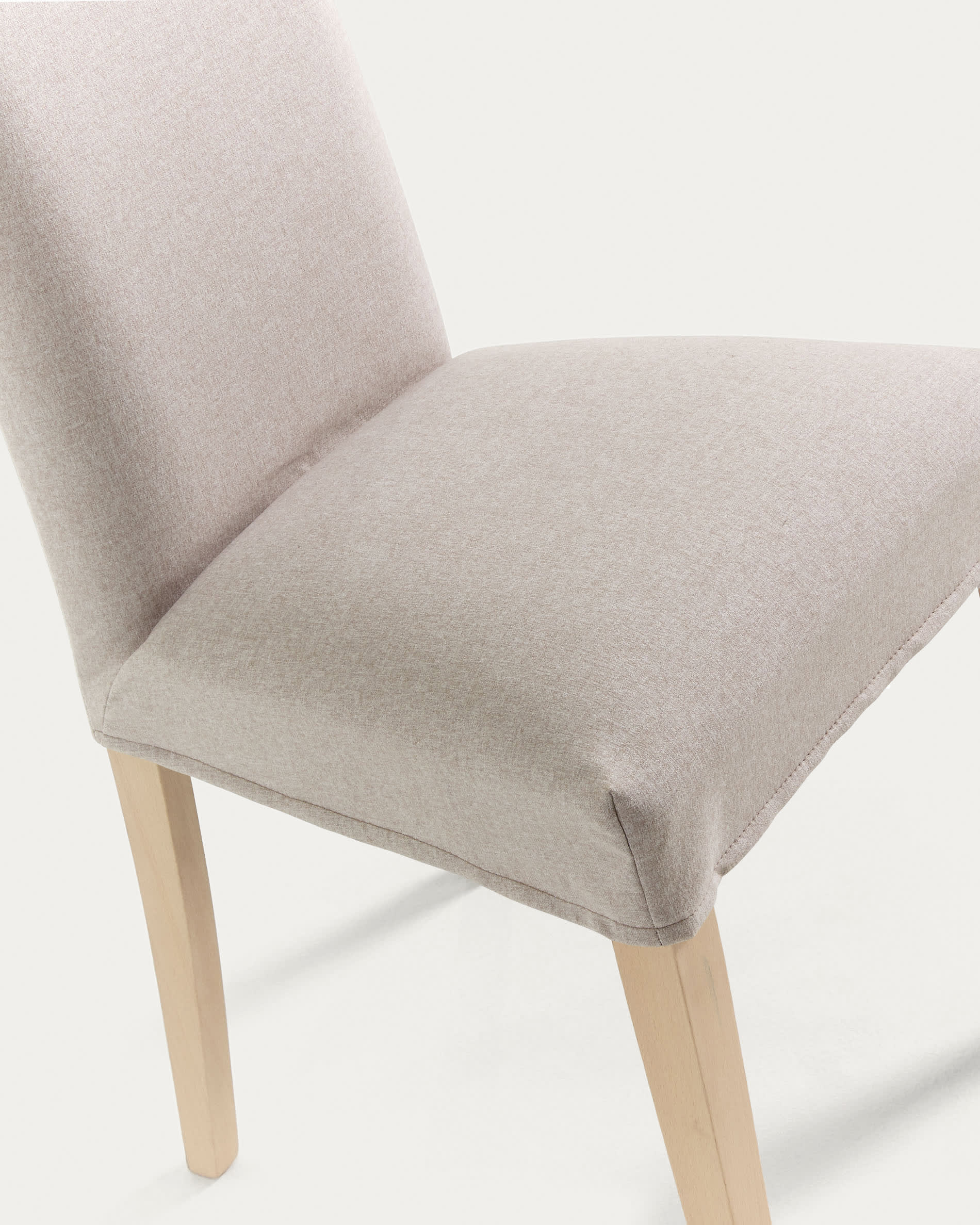 Beige Freda chair with solid beechwood legs in a natural finish