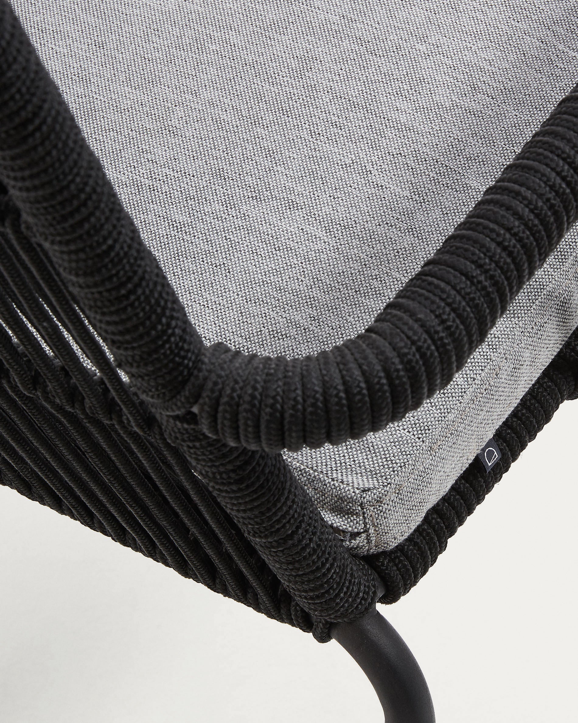 Samanta stackable chair made from black cord and galvanised steel legs. - Detail