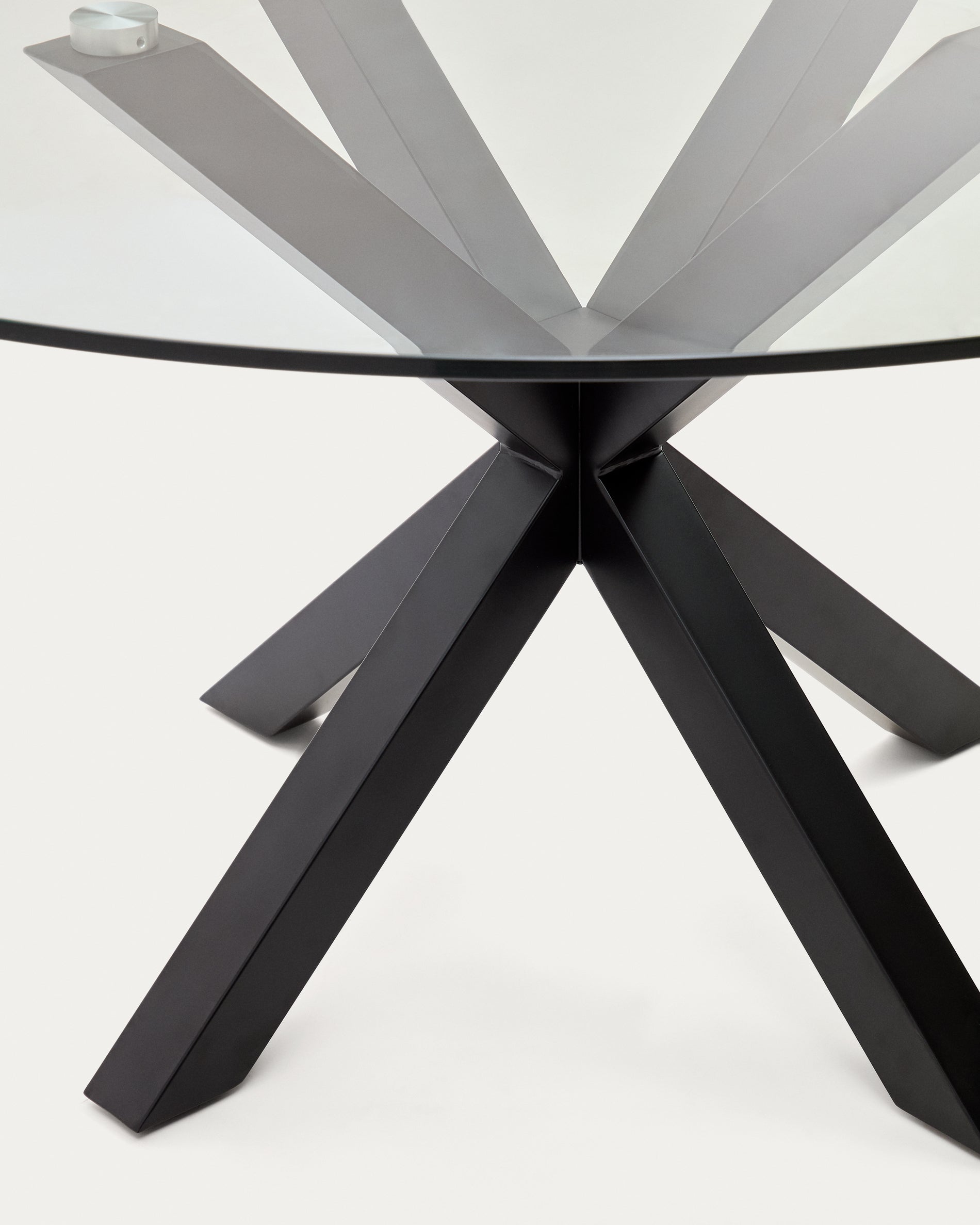 Argo round table with glass and steel legs, black finish Ø 150 cm
