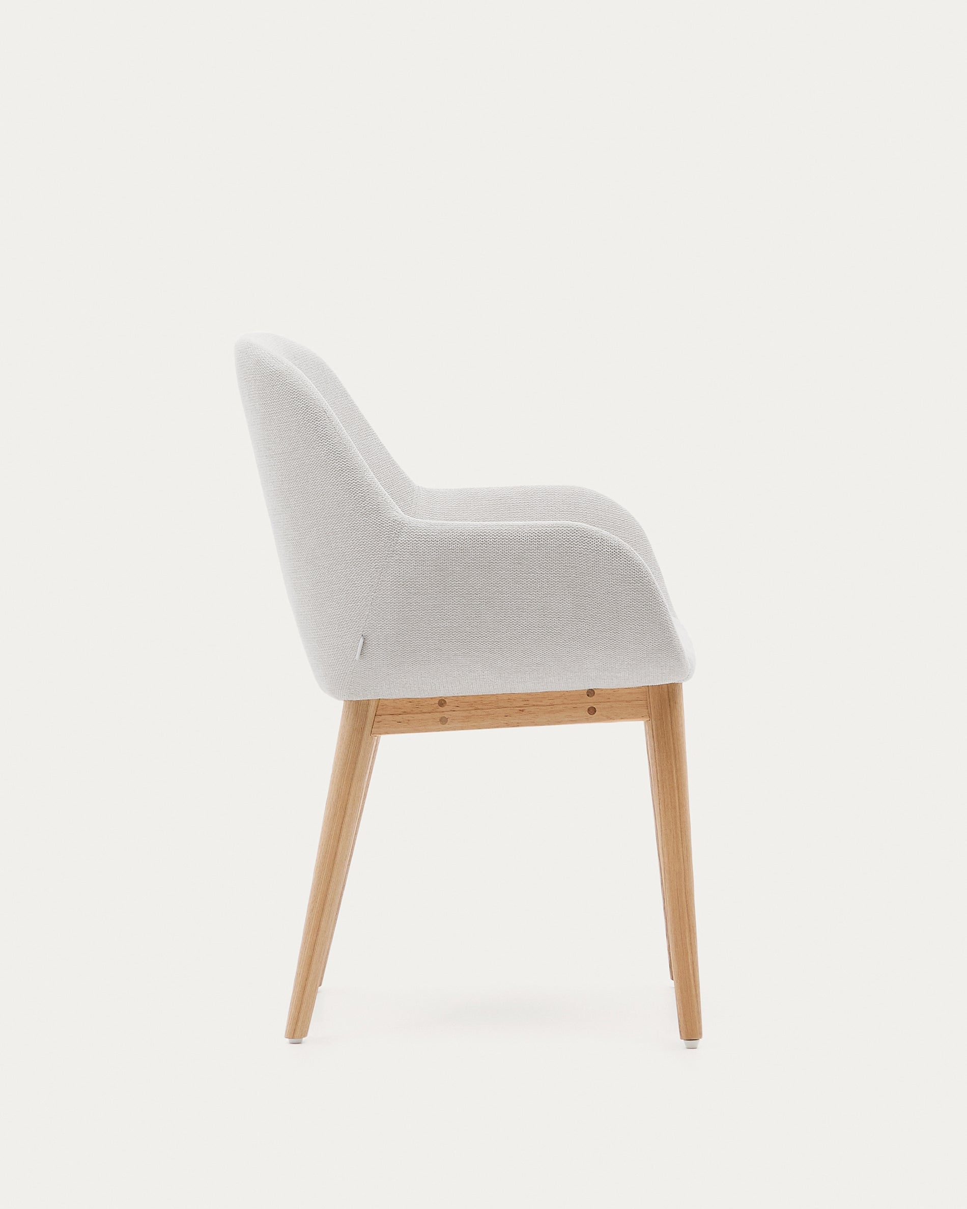 Konna chair in beige color with natural finished solid ash wood legs