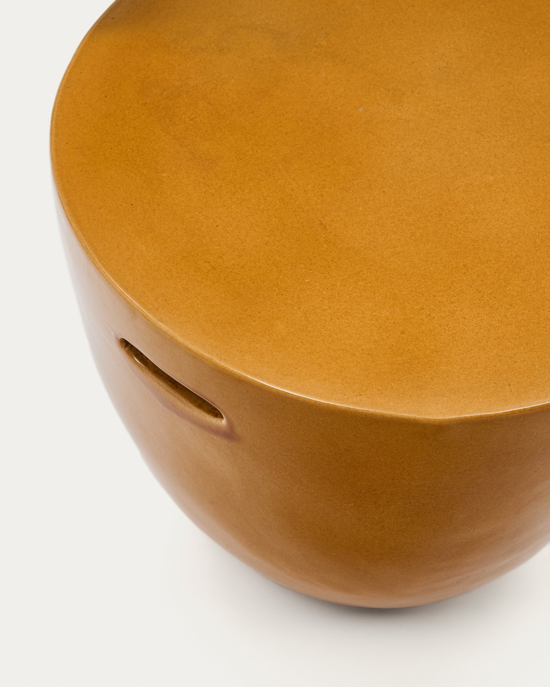 Mesquida outdoor side table made of ceramic, glazed mustard yellow finish Ø 45 cm
