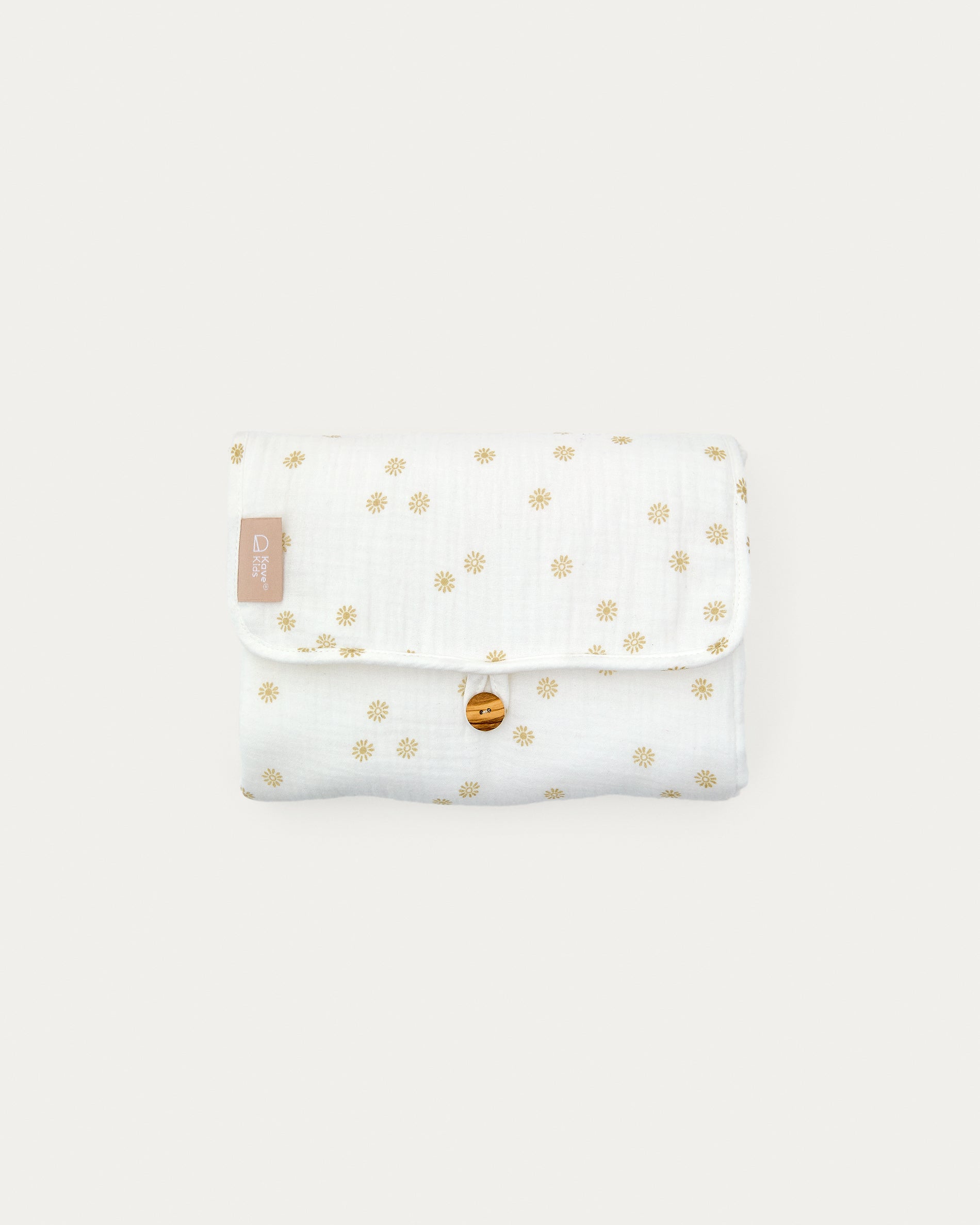 Olna travel changing mat in 100% cotton with a sun print - Product View