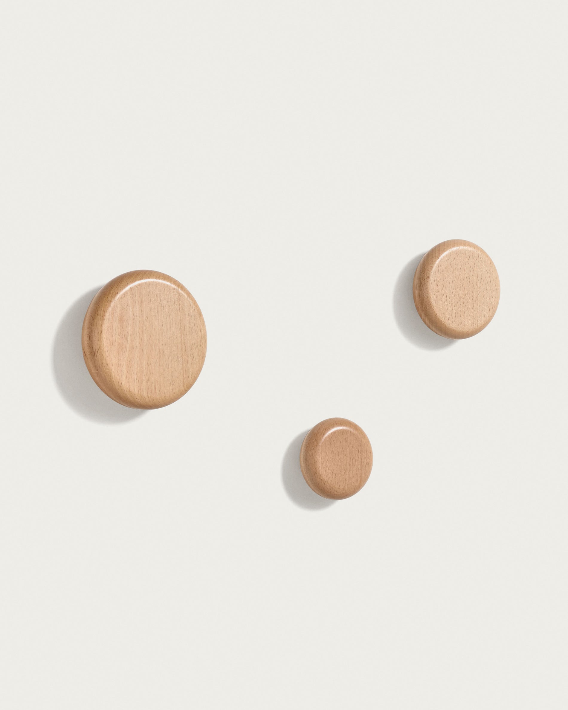 Nadue set of 3 solid beech wood wall hooks with a natural finish - Product View