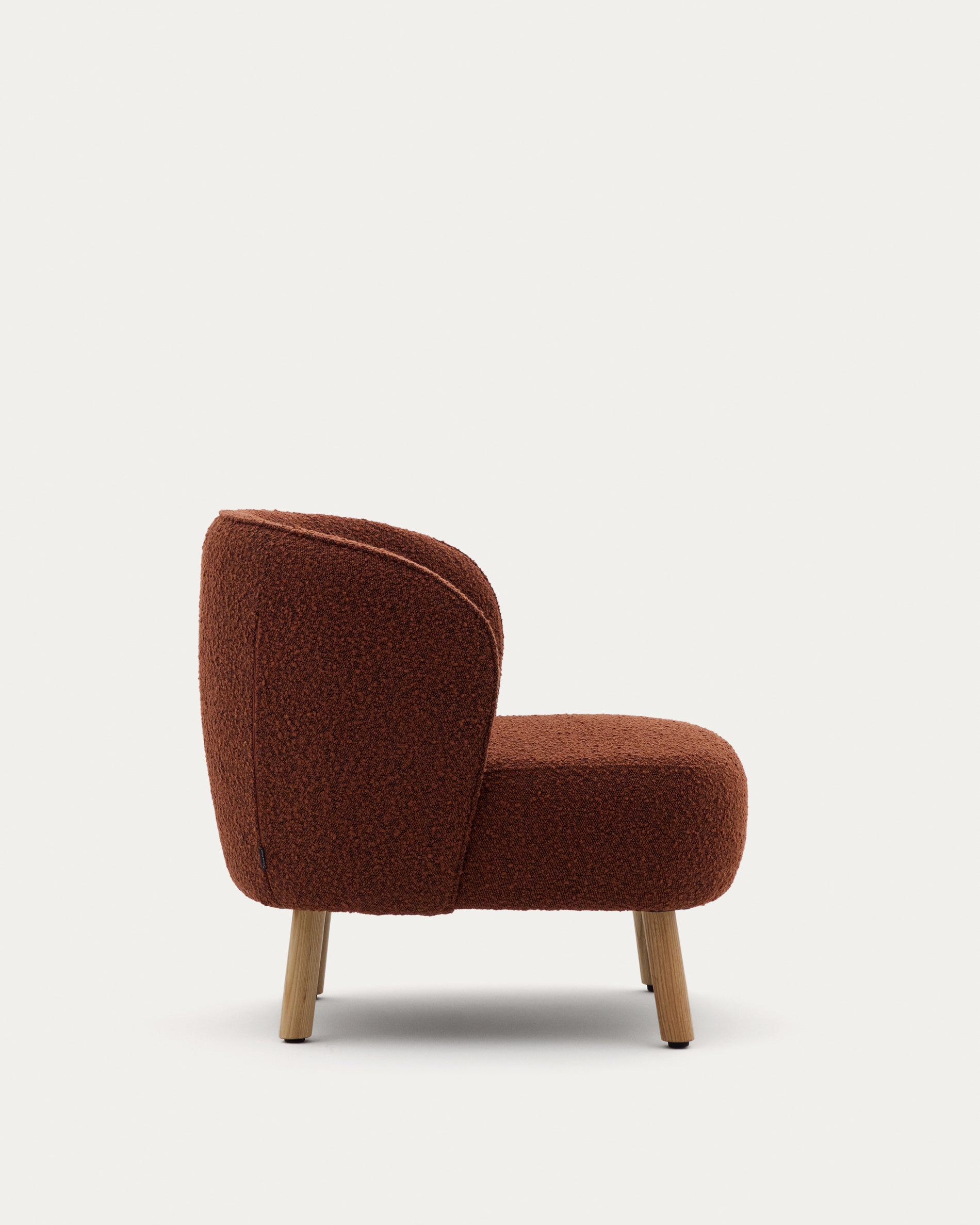 Ulit armchair in terracotta bouclé with solid beech wood legs in a natural finish - Product View