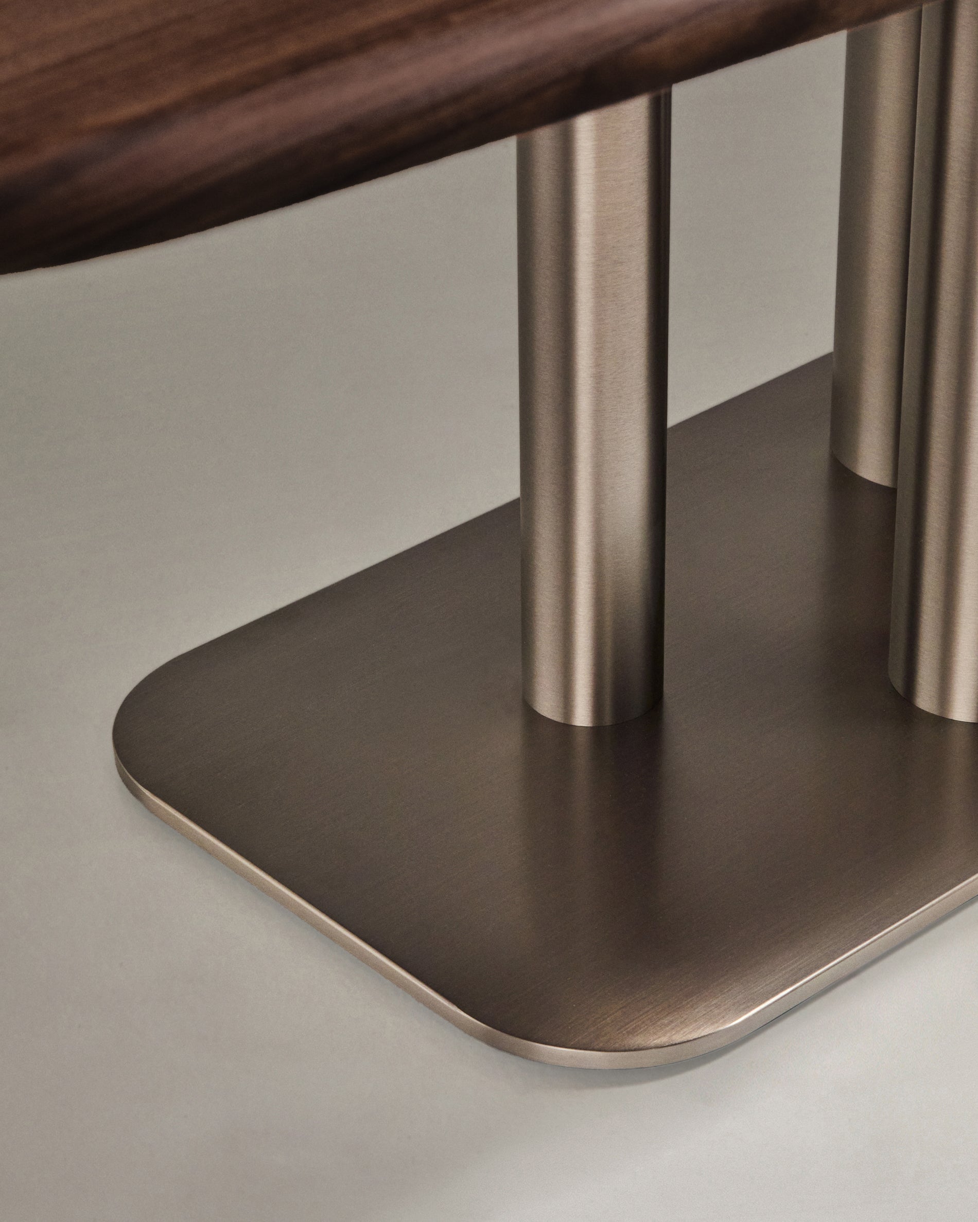 Melvar table made from walnut veneer and legs with brushed stainless steel base 180 x 100cm - Detail