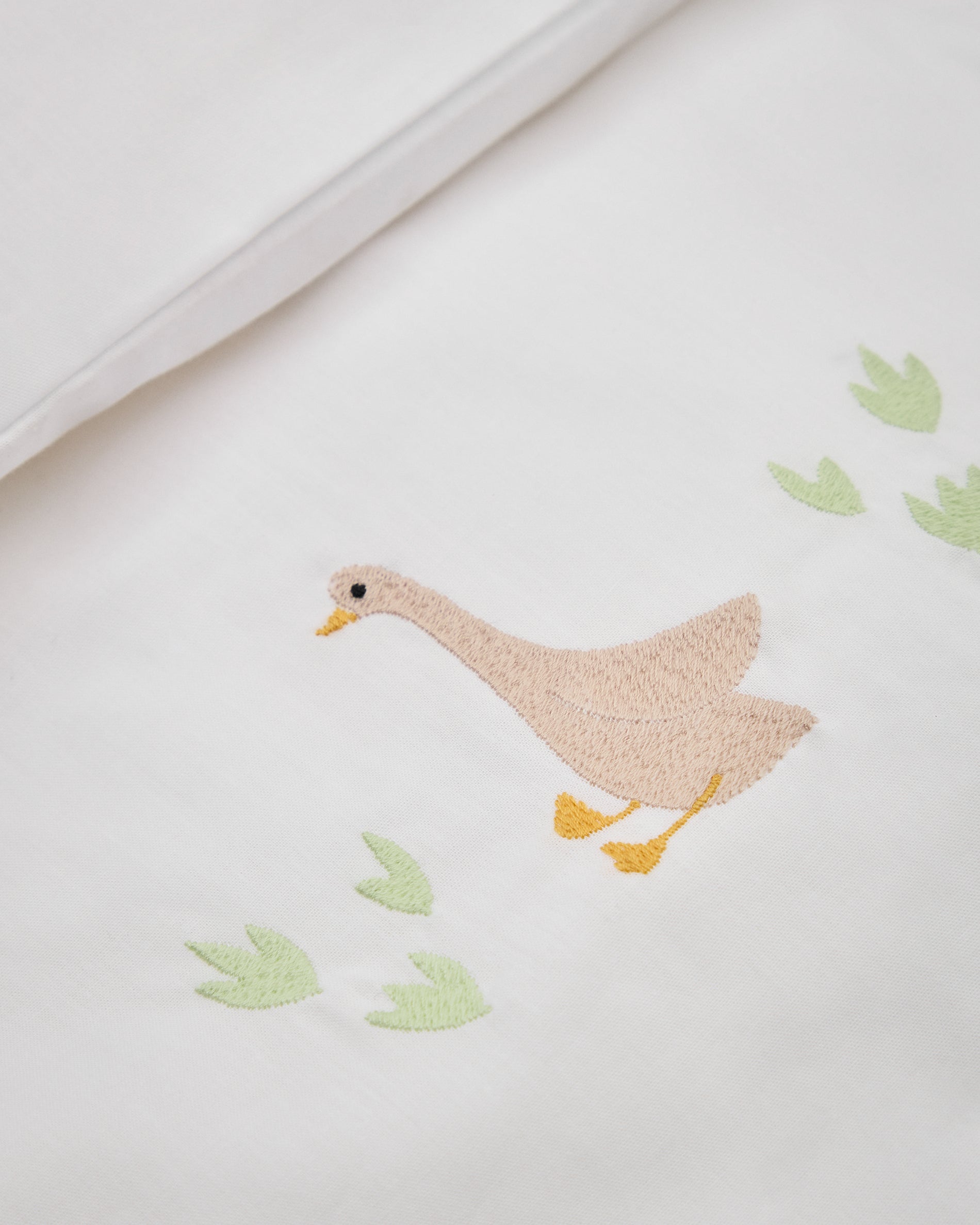 Milu set of duvet cover and pillow cases with embroidered goose for convertible cot and bed 70 x 140 cm - Detail