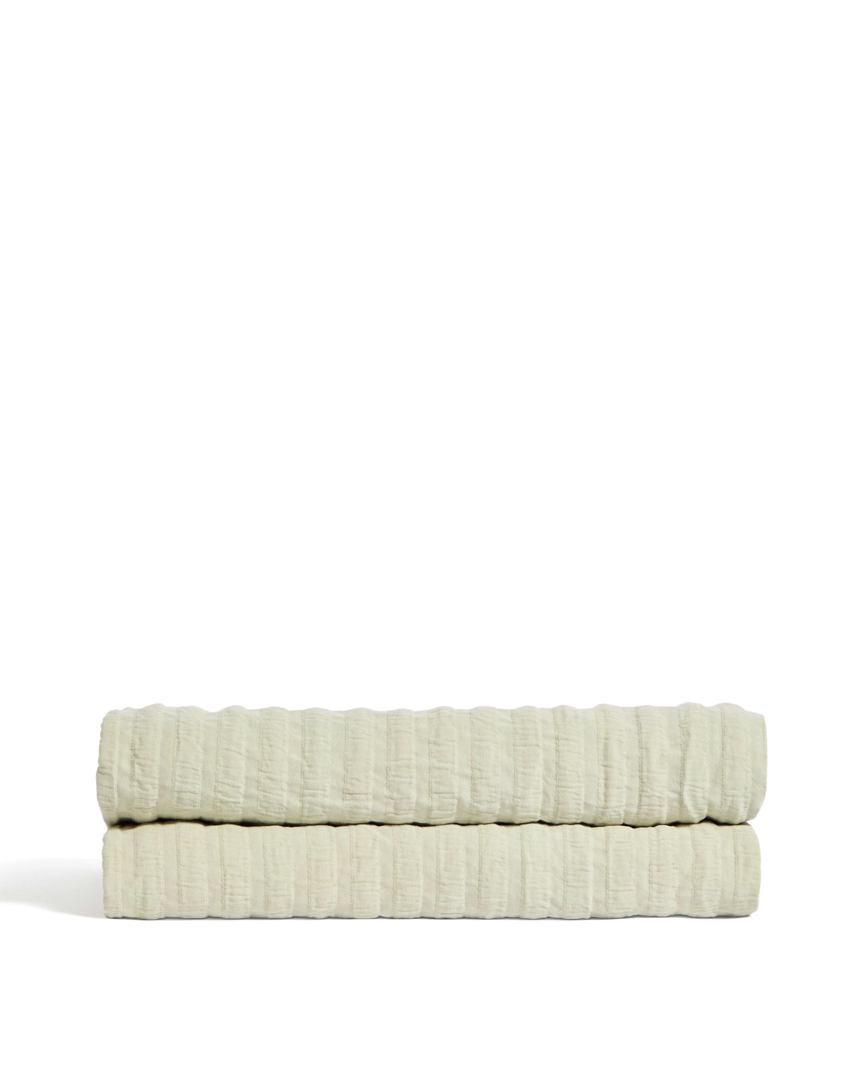 Rilune 100% cotton bedspread with light green embossed stripe effect for convertible cot - Product Image