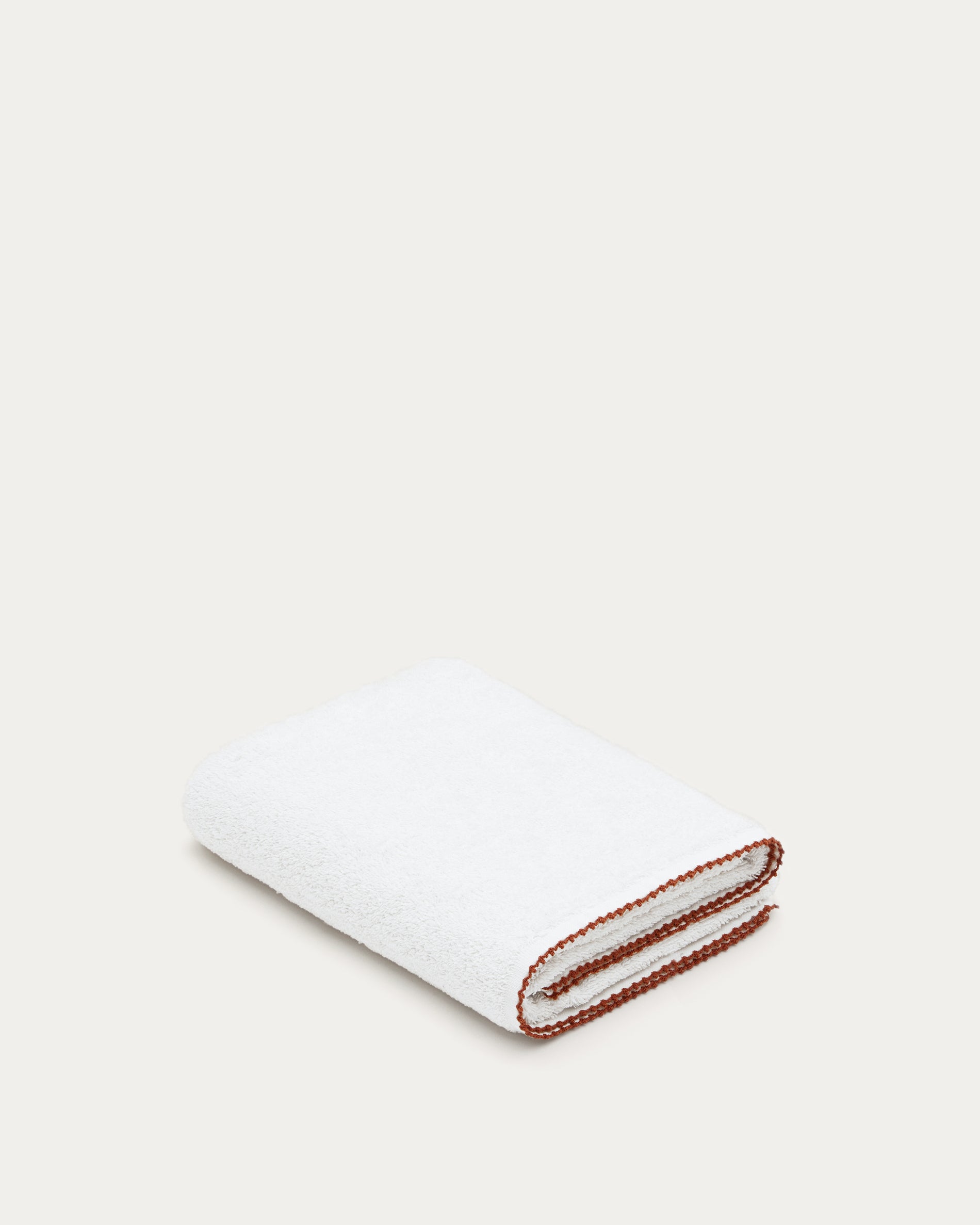 Sinami hand towel made of 100% white cotton with contrasting terracotta details 50 x 90 cm