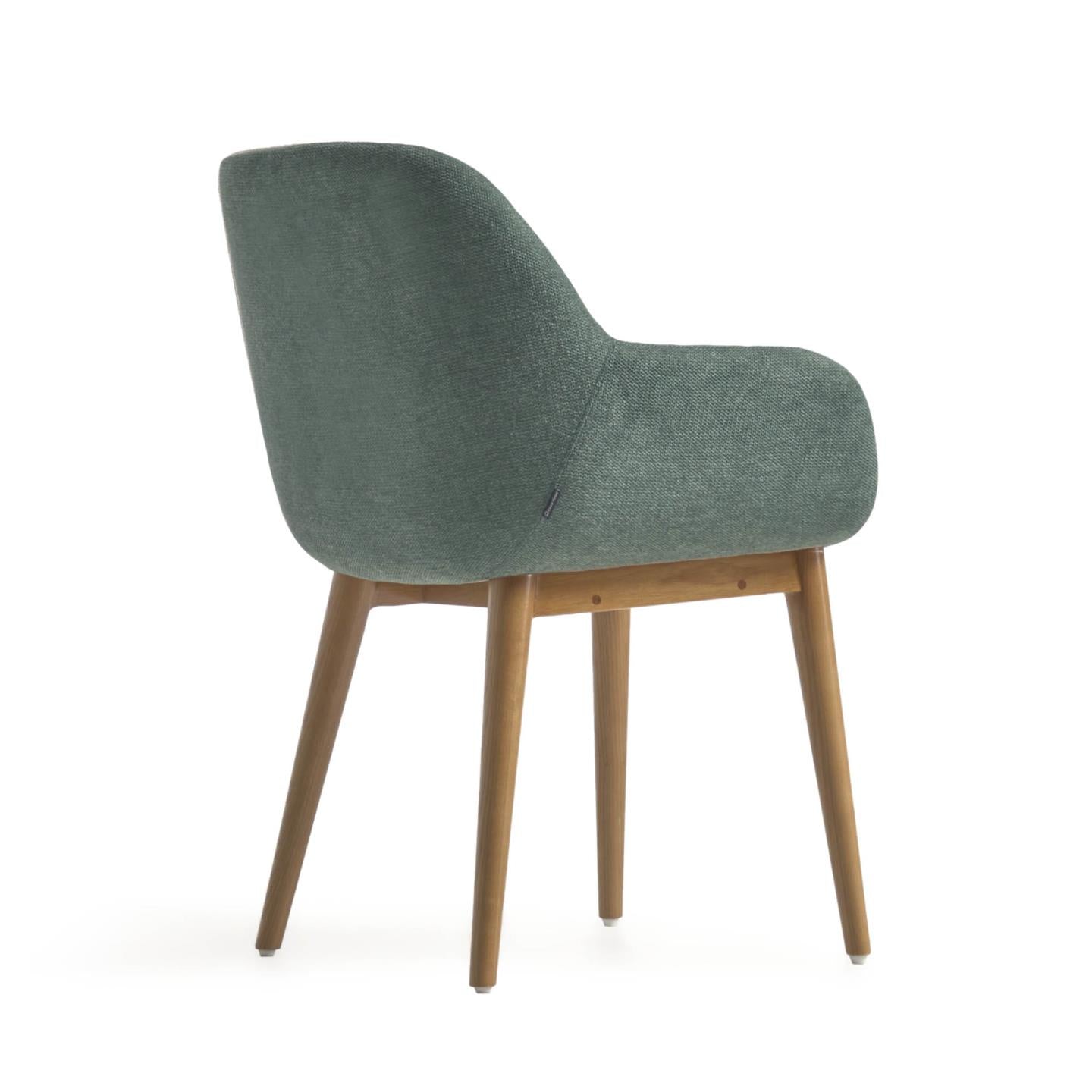 Konna chair in green with solid ash wood legs in a dark finish