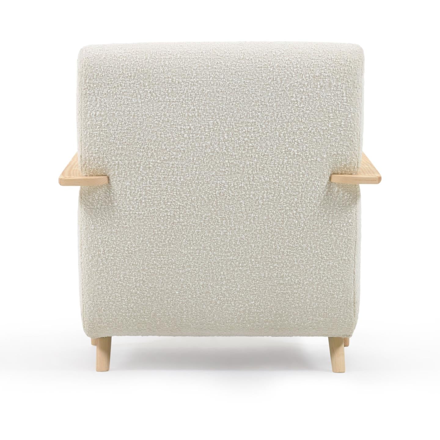 Meghan armchair in white fleece with solid ash legs with natural finish